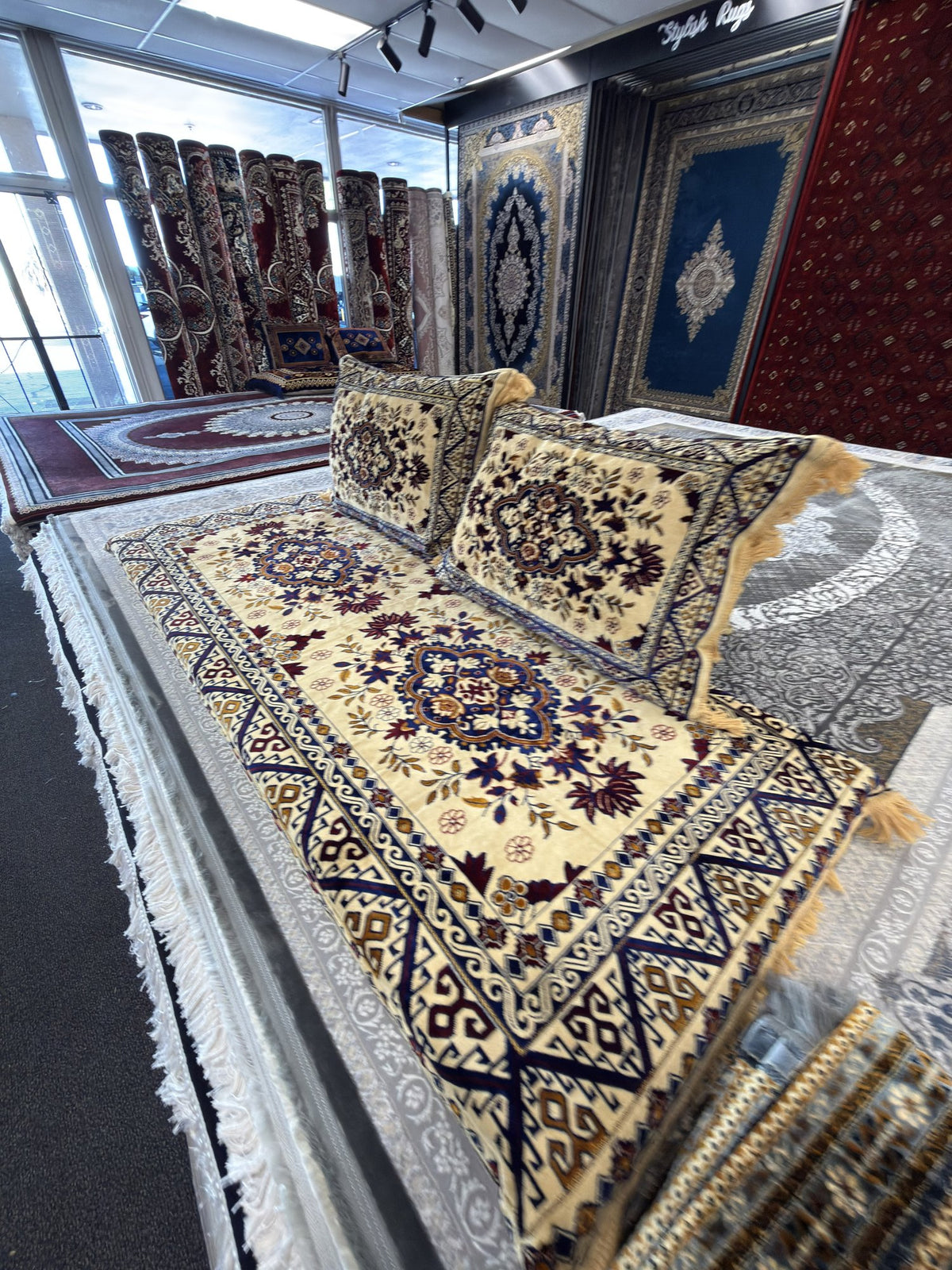 Cream and navy kilim-border Afghan toshak cover set, angled view