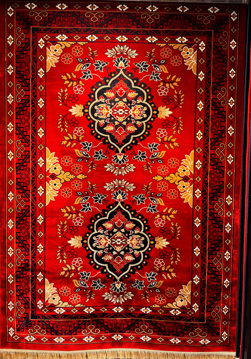 Vintage red tribal Afghan-style rug — typical wear that needs expert repair
