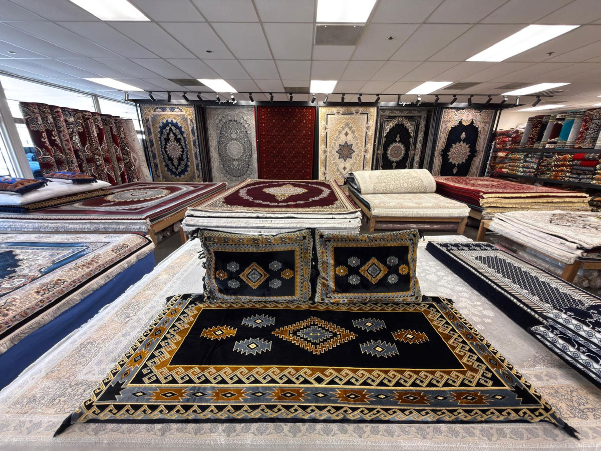 Black Afghan toshak cover with gold and grey stepped diamond medallion, detail view