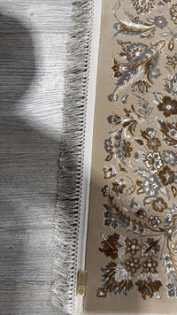 The hand-made fringe and the Stylish Rugs and Carpets label stitched to the edge of the rug