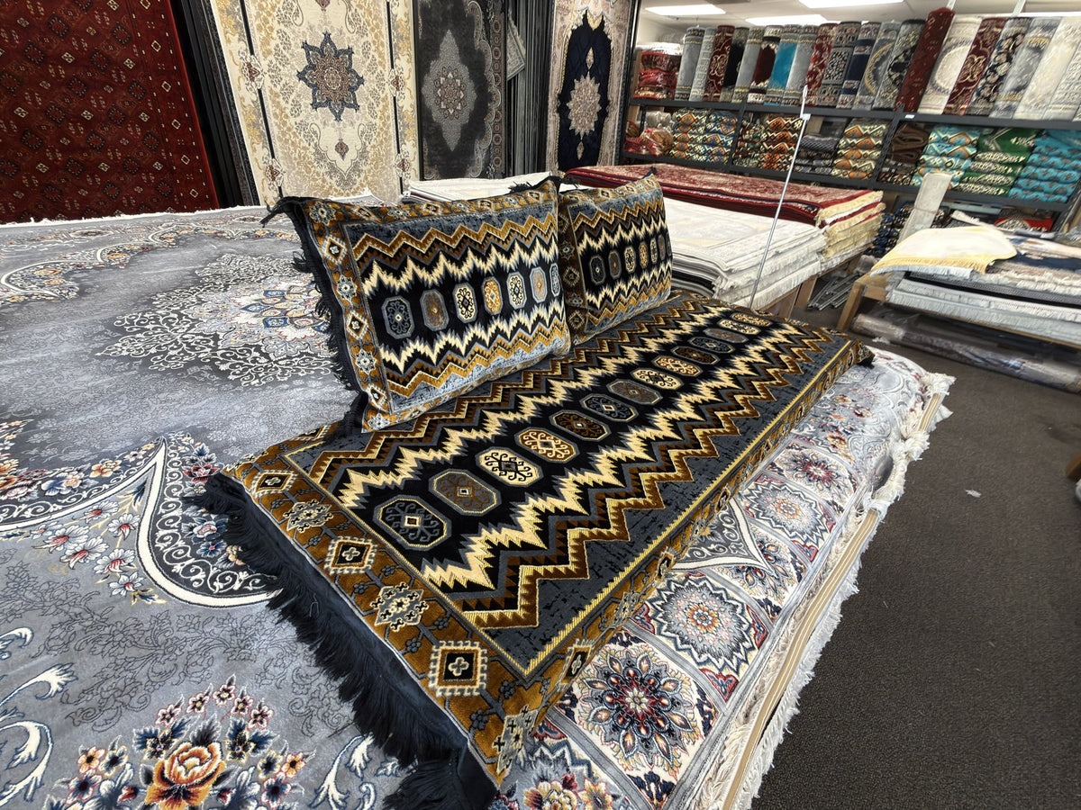 Zigzag pattern toshak cushions and mattress cover, angled view