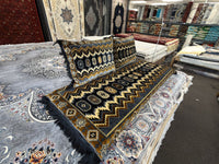 Zigzag pattern toshak cushions and mattress cover, angled view