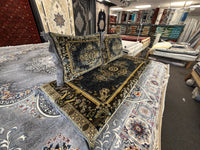 Black and gold floral medallion toshak cushions and mattress cover, angled view