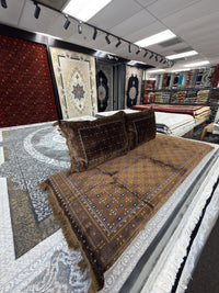 Chocolate brown Afghan toshak cover set in the Sacramento showroom