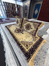 Cream Afghan toshak with navy border and two matching backrest cushions, side view