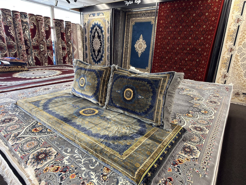 Silver blue and gold Afghan toshak cover set with round medallion cushions, showroom view